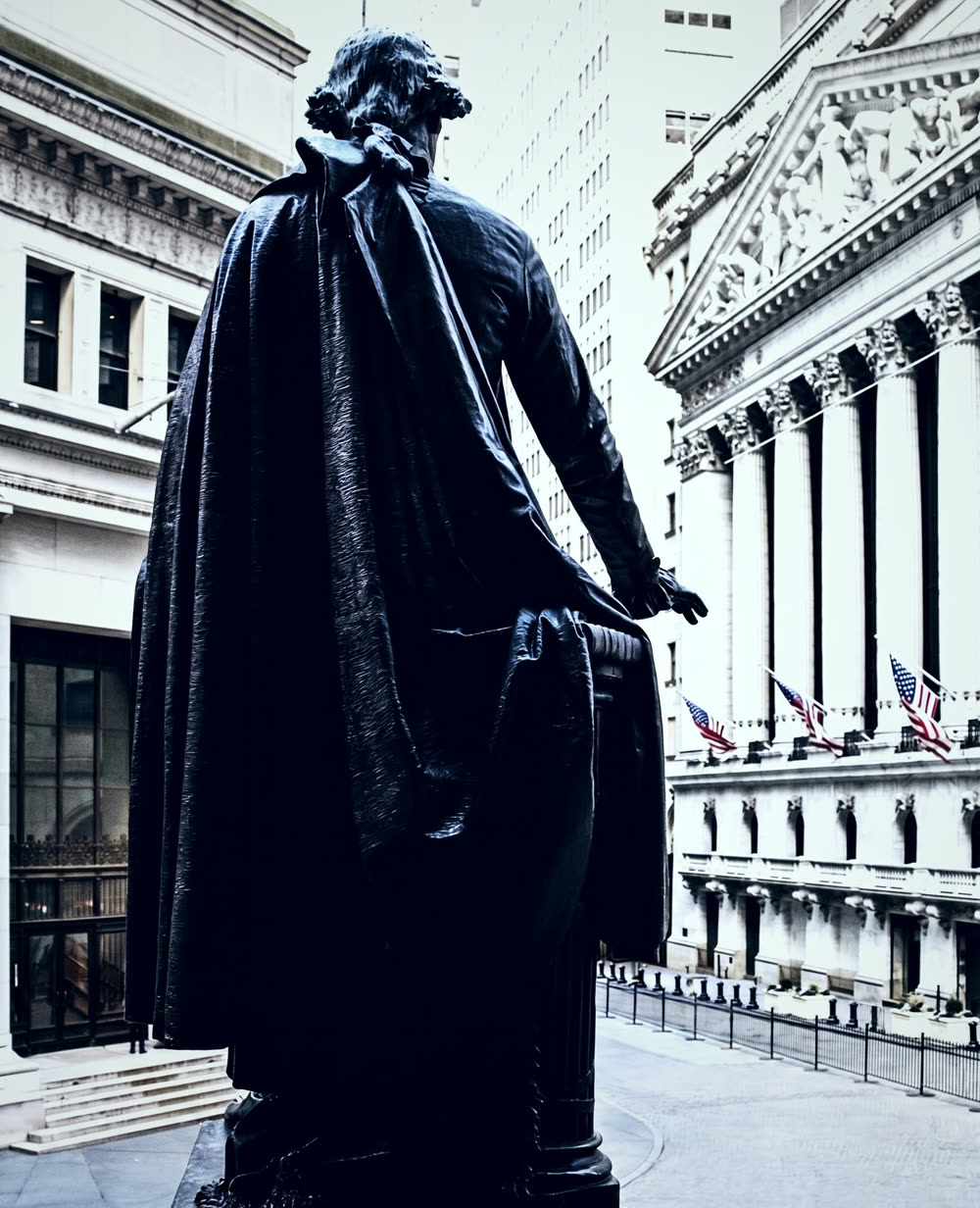 The bronze statue of George Washington on the steps of Federal Hall, facing the New York Stock Exchange.