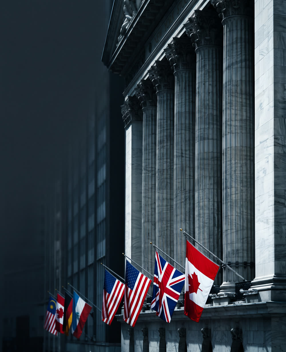 National flags of many countries hung between the columns of the New York Stock Exchange.